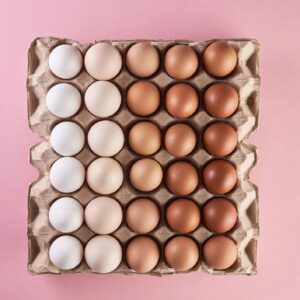 Chicken eggs of natural shades and colors on egg tray