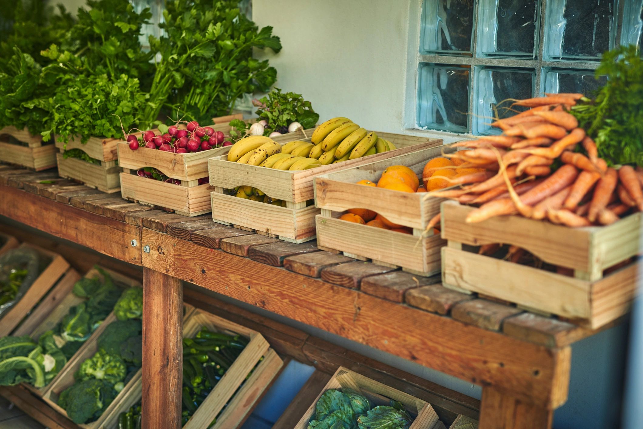 Freshly picked produce in a crate at a market